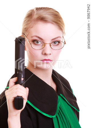 Woman lawyer attorney in polish black green gown with gun Woman lawyer attorney in polish black green gown with gun 9867942