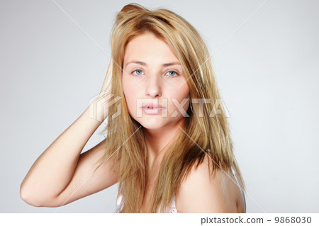 Attractive blonde woman with no make up Attractive blonde woman with no make up 9868030