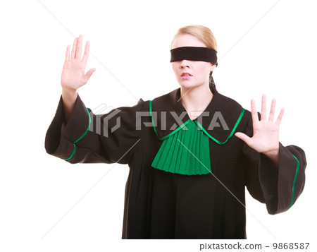 Lawyer attorney in classic polish gown covering eyes with blindfold 9868587