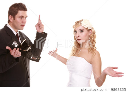 Wedding expense concept. Bride groom with empty purse Wedding expense concept. Bride groom with empty purse 9868835