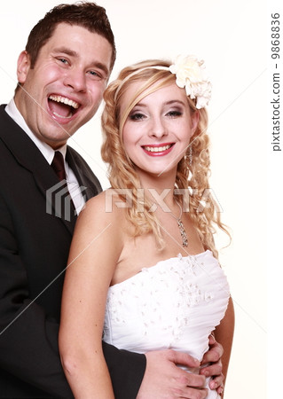 Portrait of happy bride and groom on white background Portrait of happy bride and groom on white background 9868836