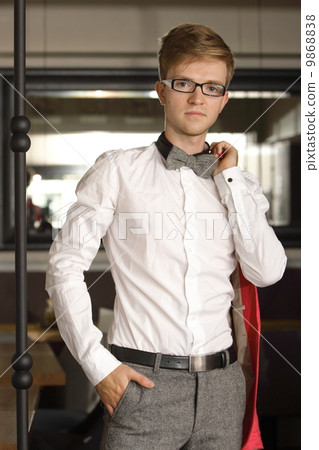 Portrait young handsome stylish man indoor Portrait young handsome stylish man indoor 9868838