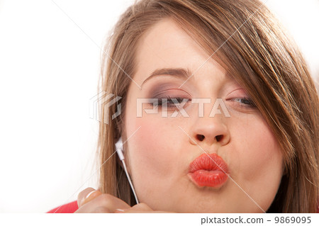 Close up funny teen girl with headphones Close up funny teen girl with headphones 9869095