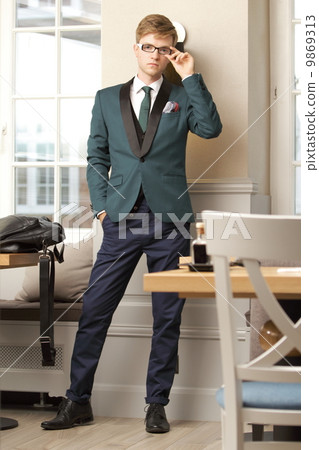 Young handsome stylish man in trendy cafe Young handsome stylish man in trendy cafe 9869313