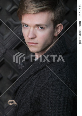 Young handsome man on street, old town Gdansk Young handsome man on street, old town Gdansk 9869350