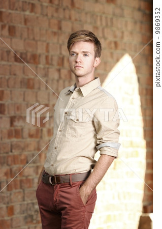 Young handsome man on street, old town Gdansk Young handsome man on street, old town Gdansk 9869352