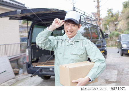 Male carrying baggage 9871971