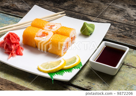 Traditional Philadelphia sushi rolls on white plate with chopstick and wasabi 9872206