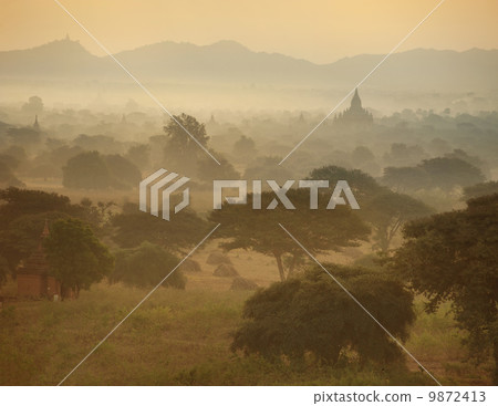 Panorama View of Sunrise over temples of Bagan in Myanmar Panorama View of Sunrise over temples of Bagan in Myanmar 9872413