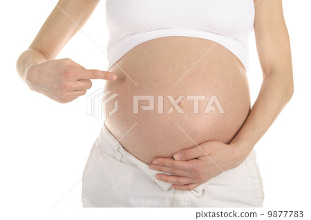 Pregnant woman shows her belly Pregnant woman shows her belly 9877783