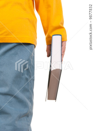 Teenager holds book in hand 9877832