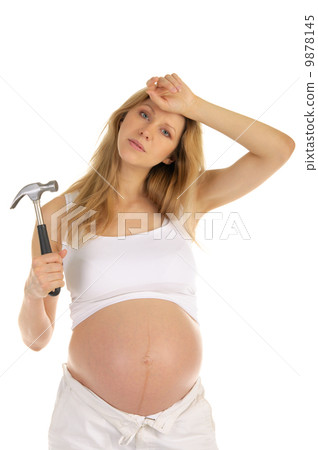tired pregnant woman with a hammer tired pregnant woman with a hammer 9878145