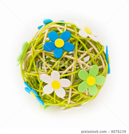 Beautiful sphere made of bound wicker with florets Beautiful sphere made of bound wicker with florets 9878239