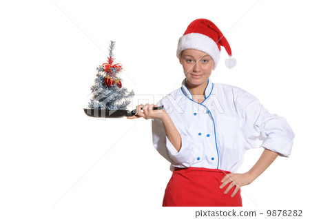 woman-cook with frying pan and Christmas tree woman-cook with frying pan and Christmas tree 9878282