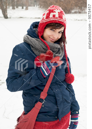 Attractive young woman with two hearts in the hand Attractive young woman with two hearts in the hand 9878457