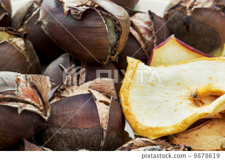 Delicious roasted chestnuts and dried sliced apples Delicious roasted chestnuts and dried sliced apples 9878619