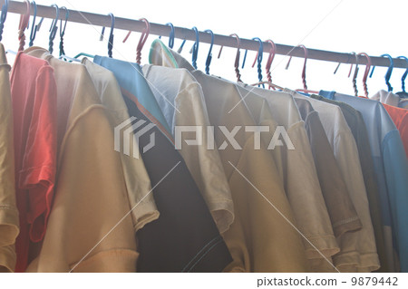 Shirts hanging on clothes line 9879442