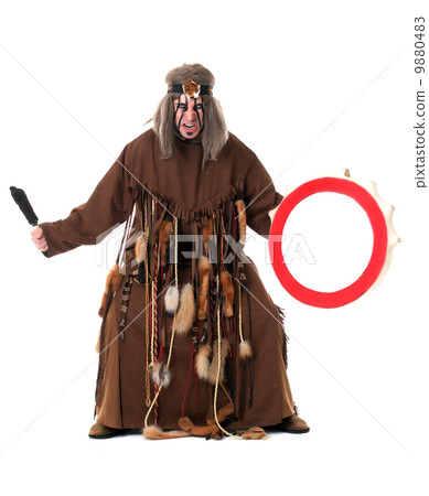 Aggressive middle-aged shaman posing at camera 9880483