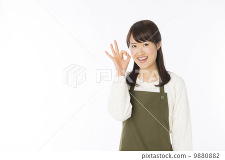 A woman in an apron A woman in an apron 9880882
