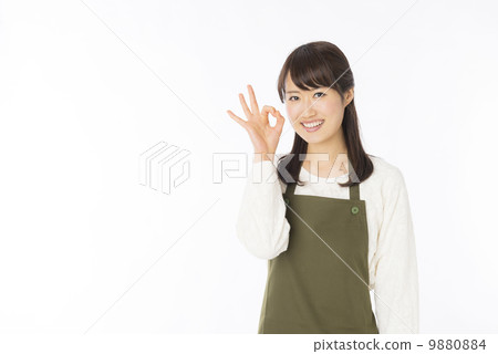 A woman in an apron A woman in an apron 9880884