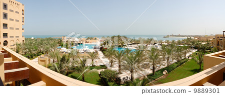 The panorama of beach at luxury hotel, Ras Al Khaimah, UAE The panorama of beach at luxury hotel, Ras Al Khaimah, UAE 9889301