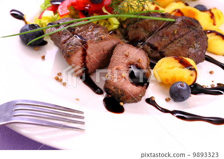 Lamb steak with potato, vegetable and balsamic sauce 9893323