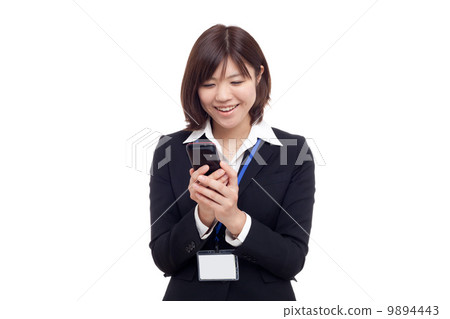 A woman looking at mail A woman looking at mail 9894443