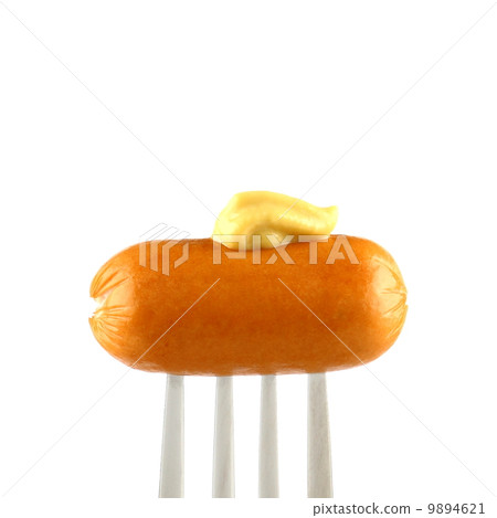 Mini cocktail sausages on fork with mustard 9894621