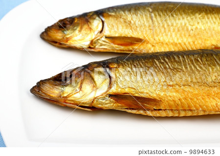 Two kippers, smoked herring on white plate Two kippers, smoked herring on white plate 9894633