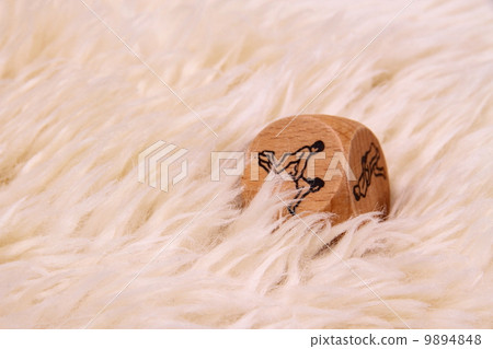 White lambskin with sex cube as background White lambskin with sex cube as background 9894848