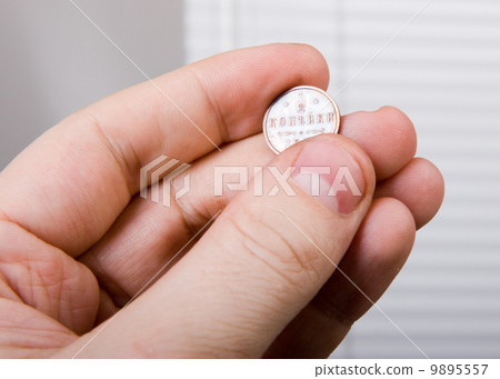 old coin in hand 9895557
