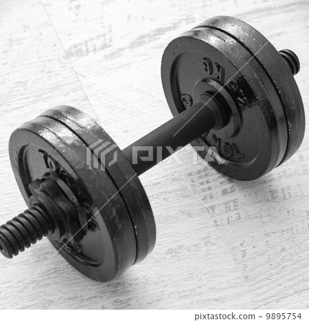 Dumbbell on desk 9895754