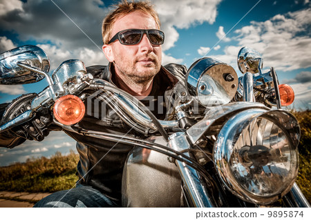 Biker on a motorcycle Biker on a motorcycle 9895874
