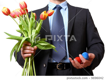 Businessman with bouquet of tulips and two eggs Businessman with bouquet of tulips and two eggs 9896042