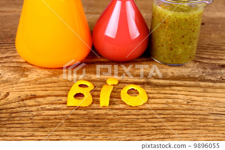 Biochemistry concept and juices from test tube Biochemistry concept and juices from test tube 9896055