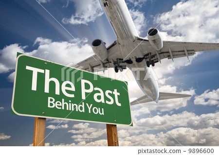 The Past Green Road Sign and Airplane Above 9896600