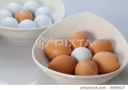 White bowls, easter eggs and golf balls White bowls, easter eggs and golf balls 9896927