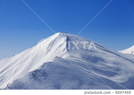 Off piste slope at sun day Off piste slope at sun day 9897489