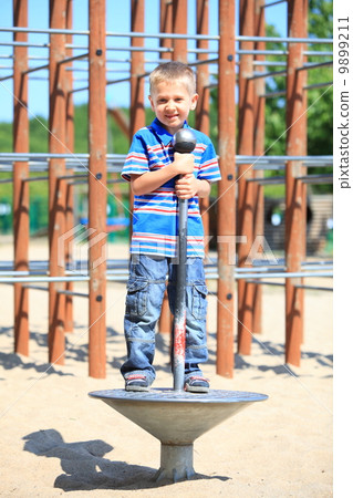 child boy or kid playing on playground child boy or kid playing on playground 9899211