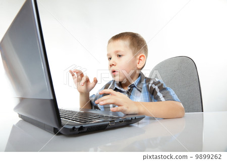 Computer addiction emotional boy with laptop Computer addiction emotional boy with laptop 9899262