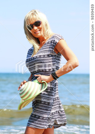 mature woman on beach summer holiday mature woman on beach summer holiday 9899489