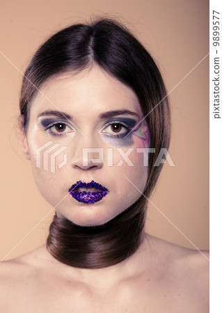 Portrait of girl woman with long straight hair and creative makeup 9899577