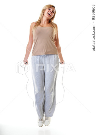 young fitness woman with jump rope isolated young fitness woman with jump rope isolated 9899605