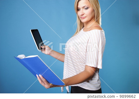 Girl with tablet computer ebook reader and book Girl with tablet computer ebook reader and book 9899662