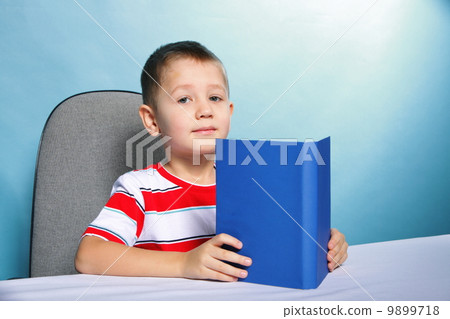 child boy kid reading a book on blue 9899718