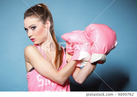 Female boxer model with big fun pink gloves Female boxer model with big fun pink gloves 9899762