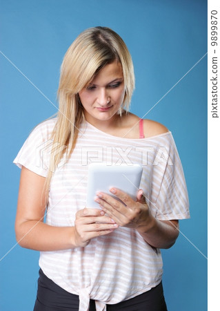 Girl with tablet computer ebook reader touchpad pc 9899870