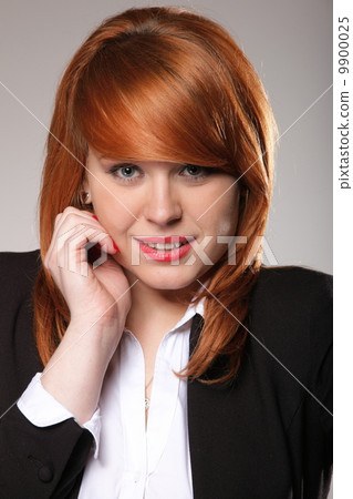 picture of a redhaired business woman's face 9900025