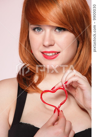 happy redhair girl with heart love symbol happy redhair girl with heart love symbol 9900030