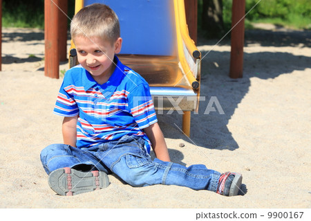child boy or kid playing on playground 9900167